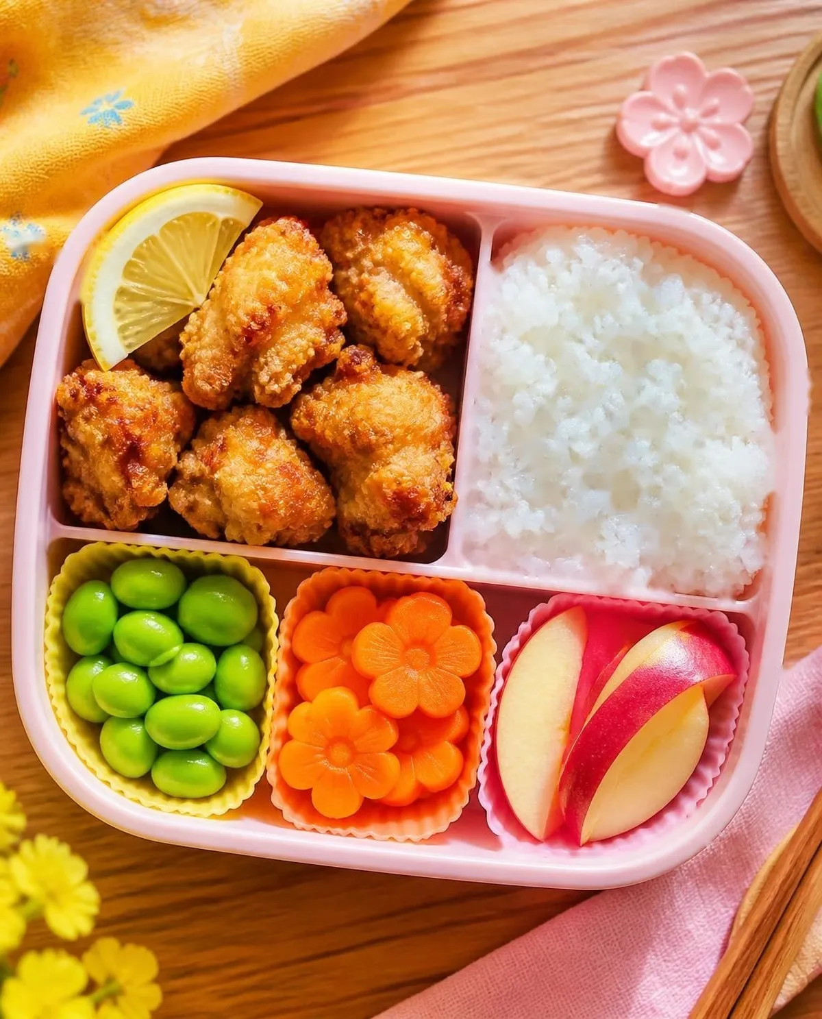 Overhead photo of Baked Karaage-Style Chicken Bites packed in a colourful kids' lunchbox